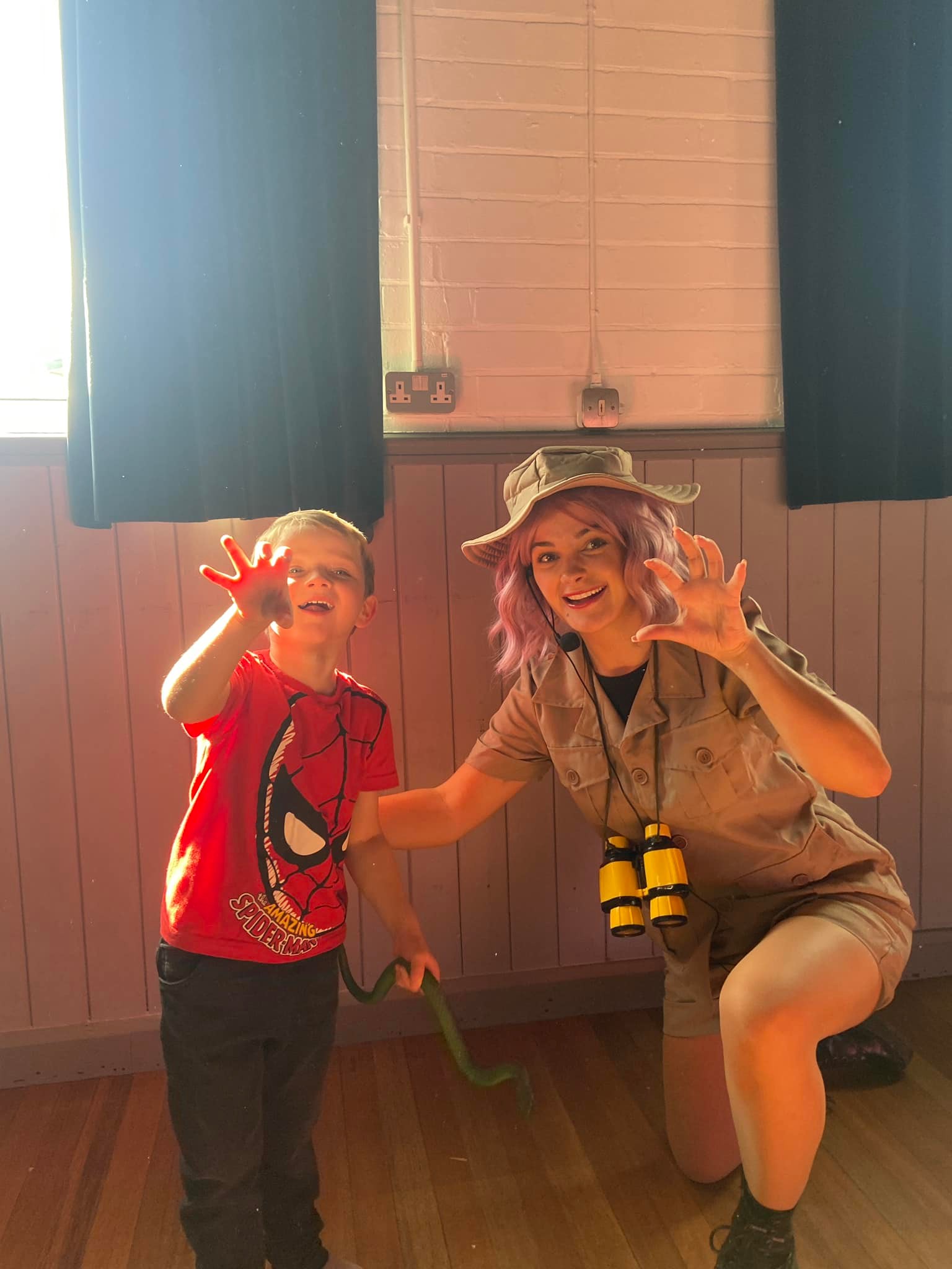 Party entertainer and child at a safari themed party